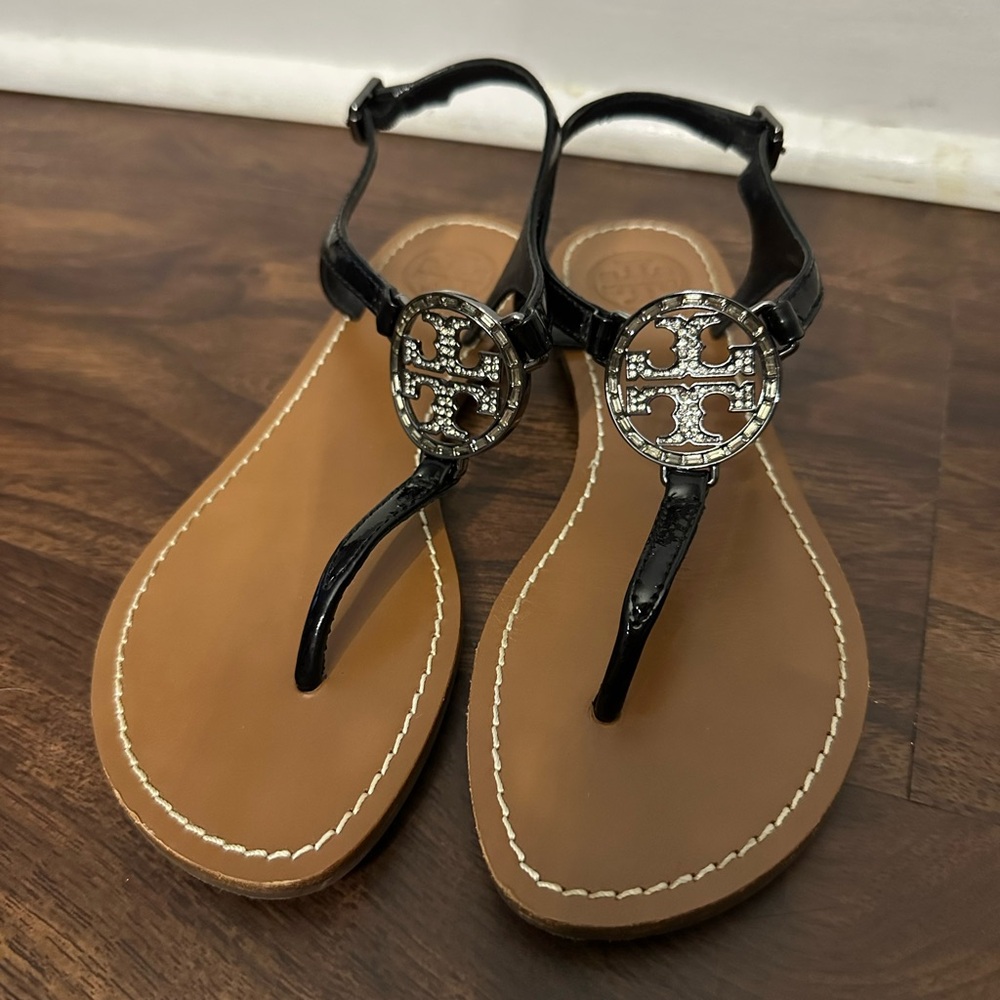 Tory Burch Black Sandals with Silver Medallion and T-Strap Design
